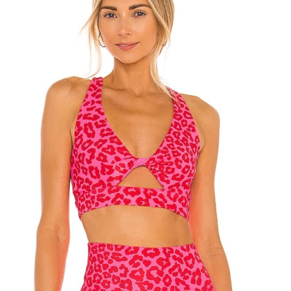 beach riot x revolve twist sports bra in famous high risk red leopard